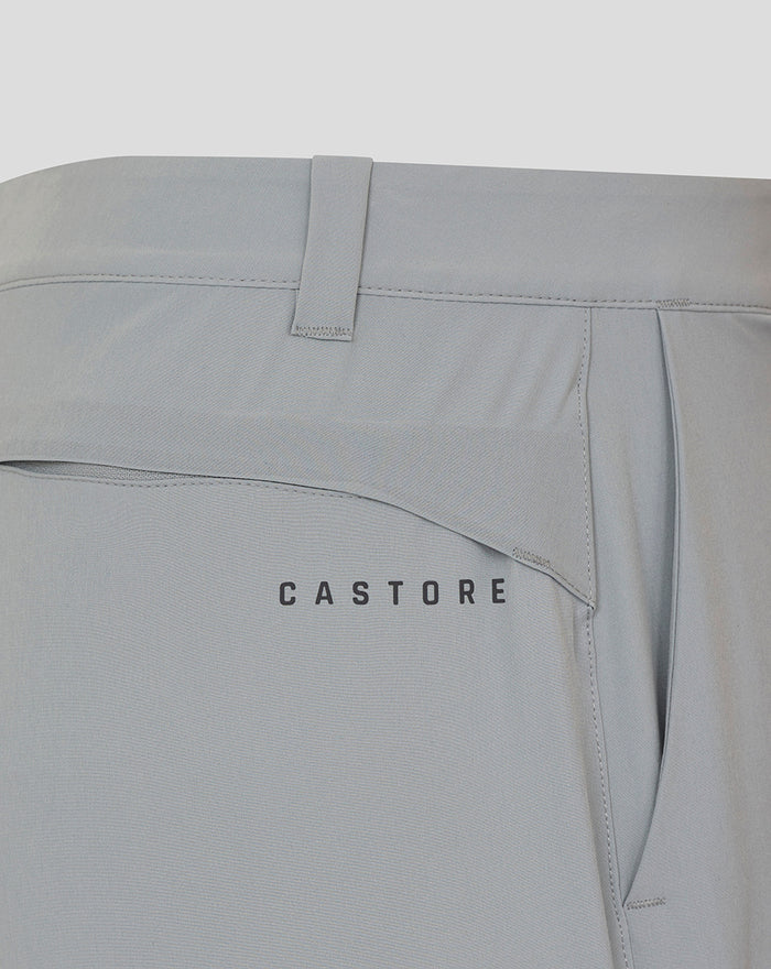 Close up of back pocket on pale gray NZC golf shorts with CASTORE logo