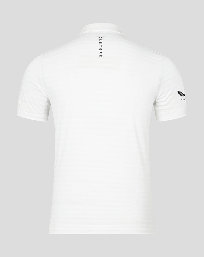 Back view of white Pinnacle stripe polo showing vertical CASTORE branding near the neckline and a small sleeve logo