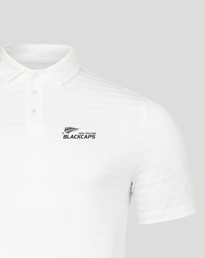 White polo shirt with three button placket and Blackcaps logo on chest