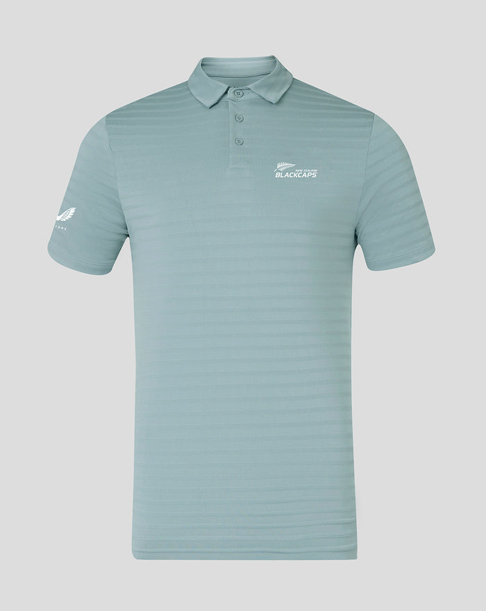 Front view of NZC Club Essential Golf Polo in light teal with subtle horizontal stripes and logo on chest