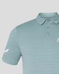 Close-up of sleeve and chest on NZC Club Essential Golf Polo in light teal with subtle stripes and sleeve logo