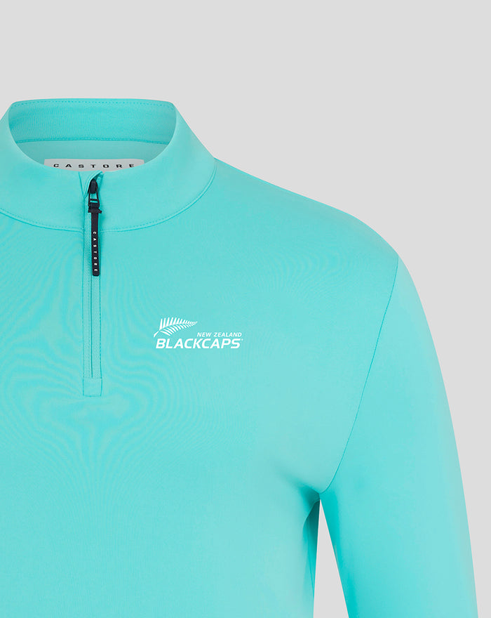 Turquoise NZC Club Classic 1/4 zip top front close up with New Zealand Blackcaps logo on the chest