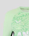 Close up of mint green training top with Blackcaps crest and Castore branding on the chest.