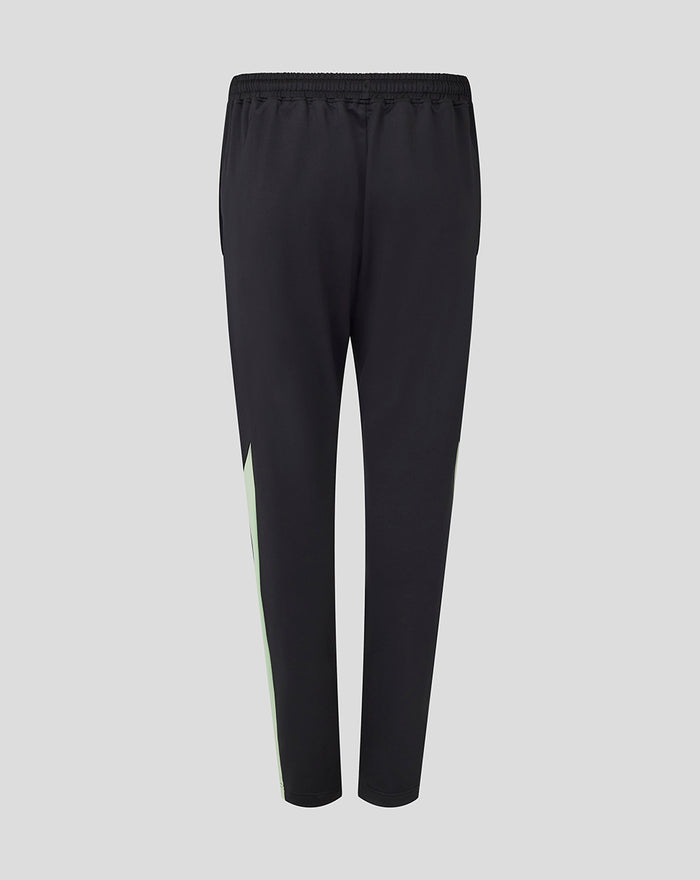 Back view of black training knit pants with neon green side stripe and elastic waistband