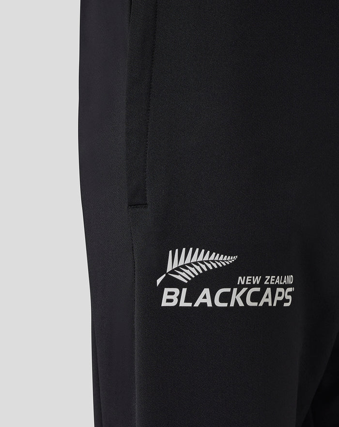 Close up of black training pants showing New Zealand BlackCaps logo on the thigh