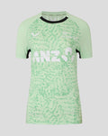 Front of mint green women's training short sleeve tee with black crew neck and abstract pattern with white logo.