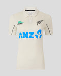 Front view of cream polo with teal Life Direct Co NZ logo and large blue ANZ graphic across the chest.