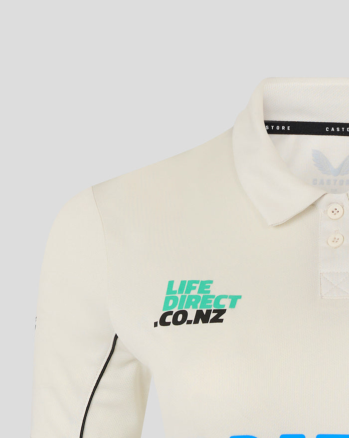 Cream polo with turquoise Life Direct CO.NZ logo on the chest and black piping along the sleeve seam
