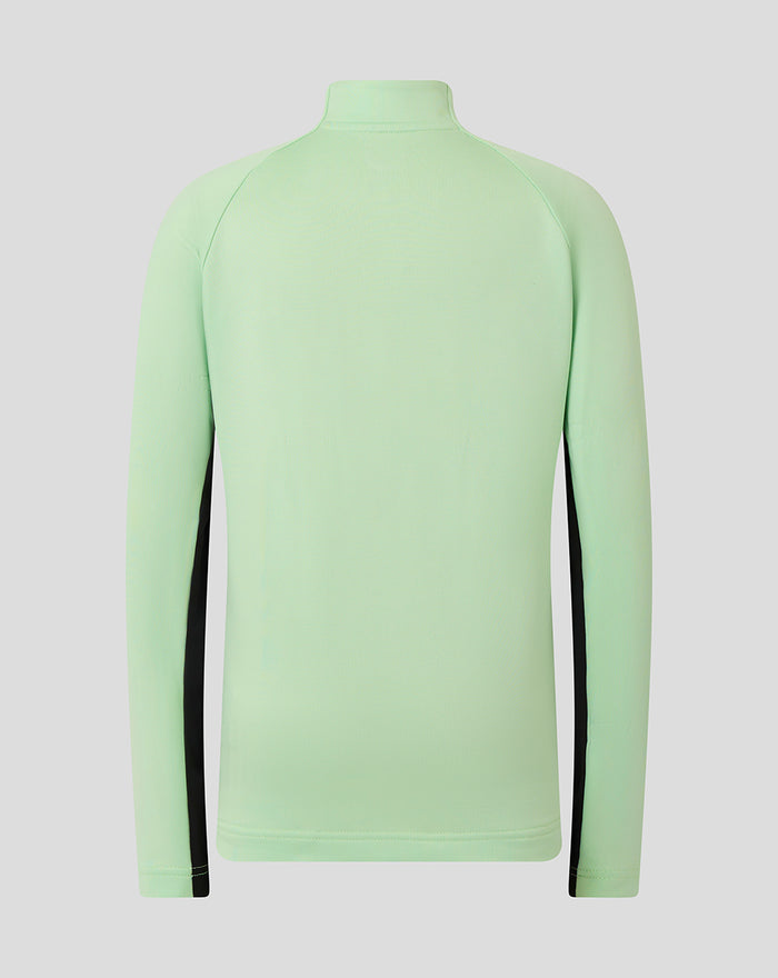Back view of light mint green junior training midlayer top with black side panels along the sleeves