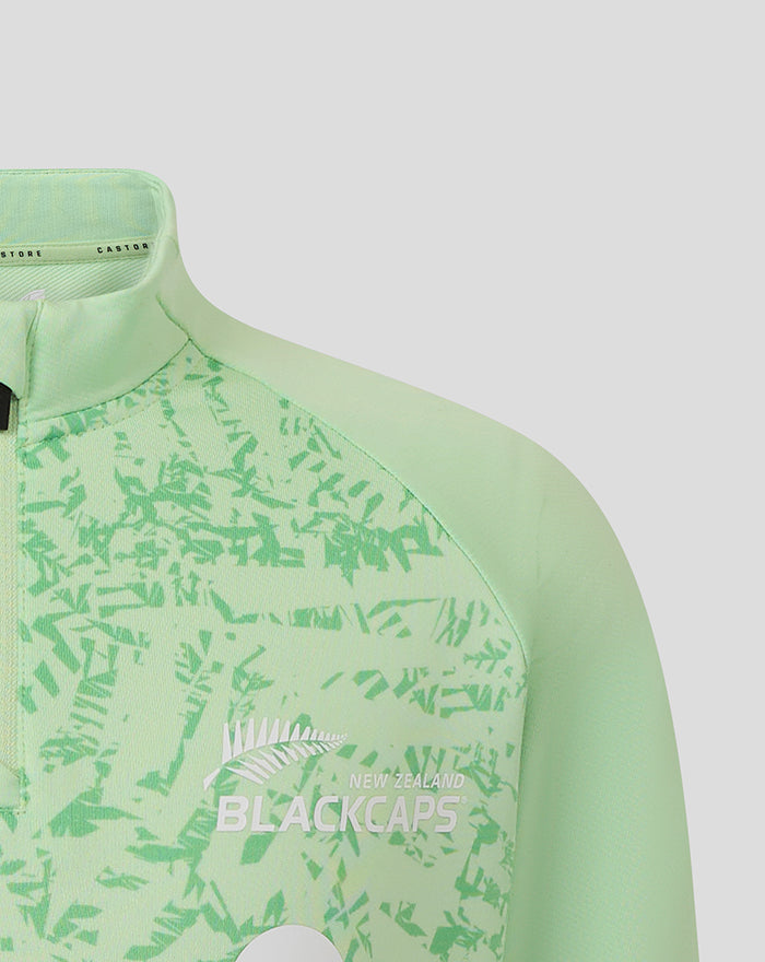 Mint green junior training midlayer top with fern pattern and New Zealand Blackcaps logo on the chest