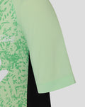 Sleeve detail of the mint green junior training T shirt showing breathable knit fabric and clean seam.