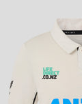 Beige junior short sleeve polo shirt with teal LIFE DIRECT CO.NZ logo on chest