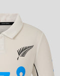 Beige polo collar close up showing Castore label and black fern logo on chest