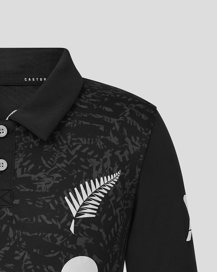 Front view of the black shirt with a white wing logo and ANZ lettering on the chest.