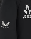 Front chest view of black Junior training hoodie with New Zealand Blackcaps logo and fern graphic.