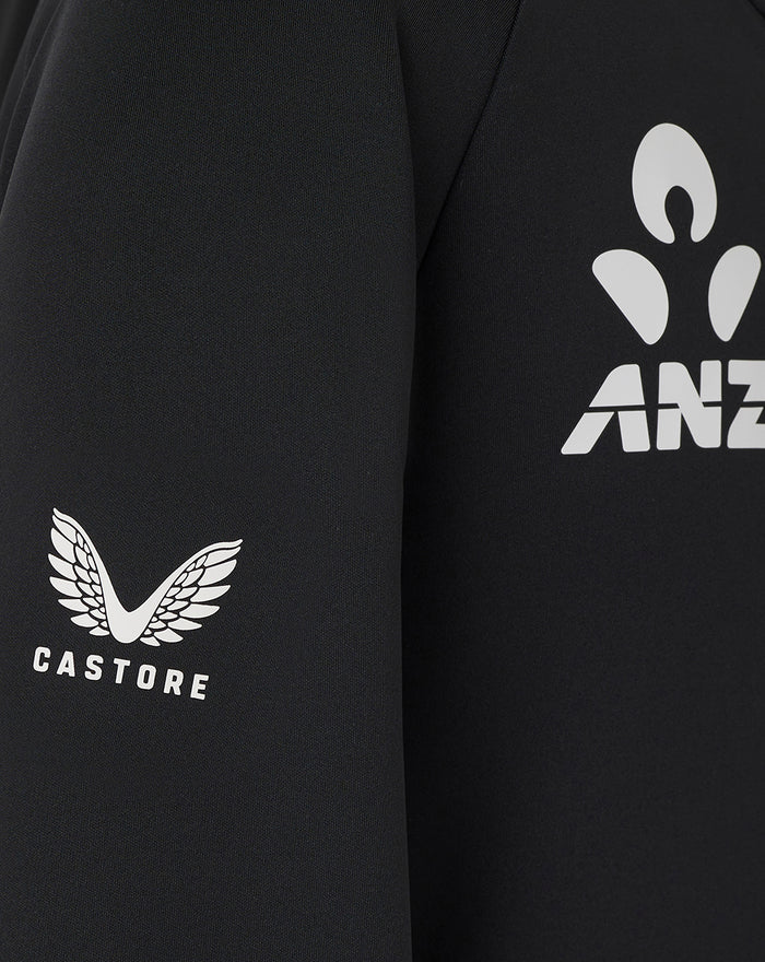 Front chest view of black Junior training hoodie with New Zealand Blackcaps logo and fern graphic.