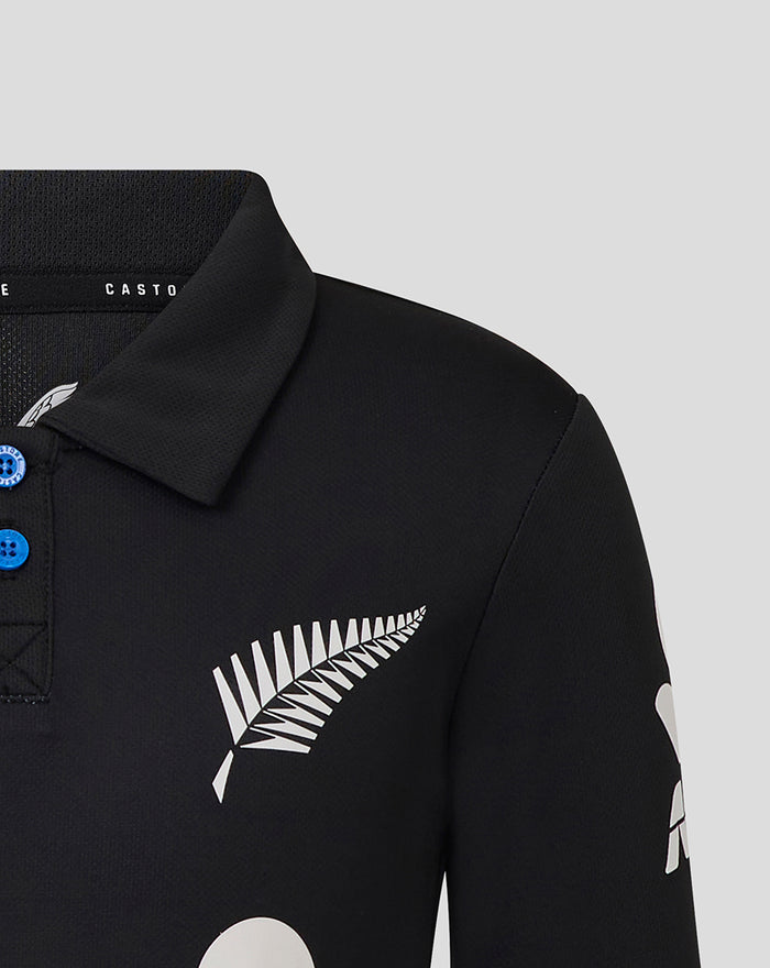 Junior T20 25/26 short sleeve cricket shirt in black with a white fern logo and blue button placket.