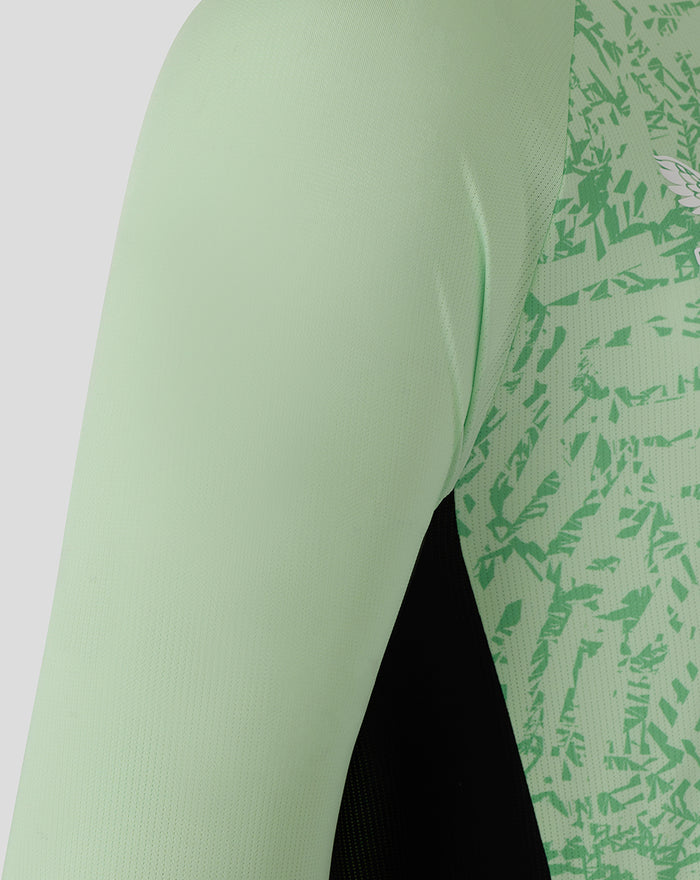 Close up of a patterned green side panel on the sleeve of the Mens 25/26 Training Long Sleeve T Shirt