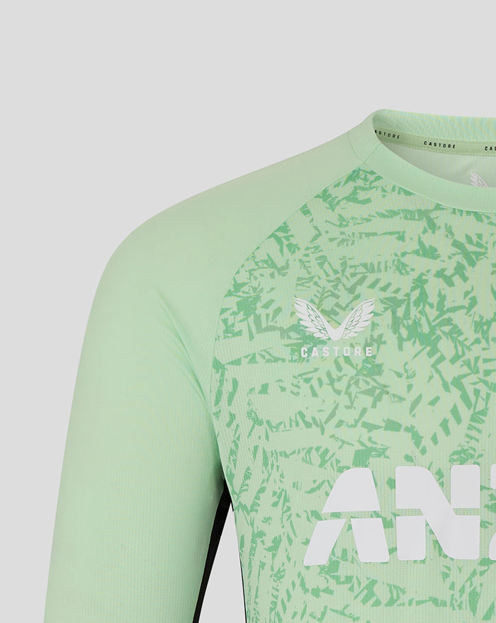 Close up of the mint green long sleeve training T shirt neckline showing shoulder seam and graphic pattern