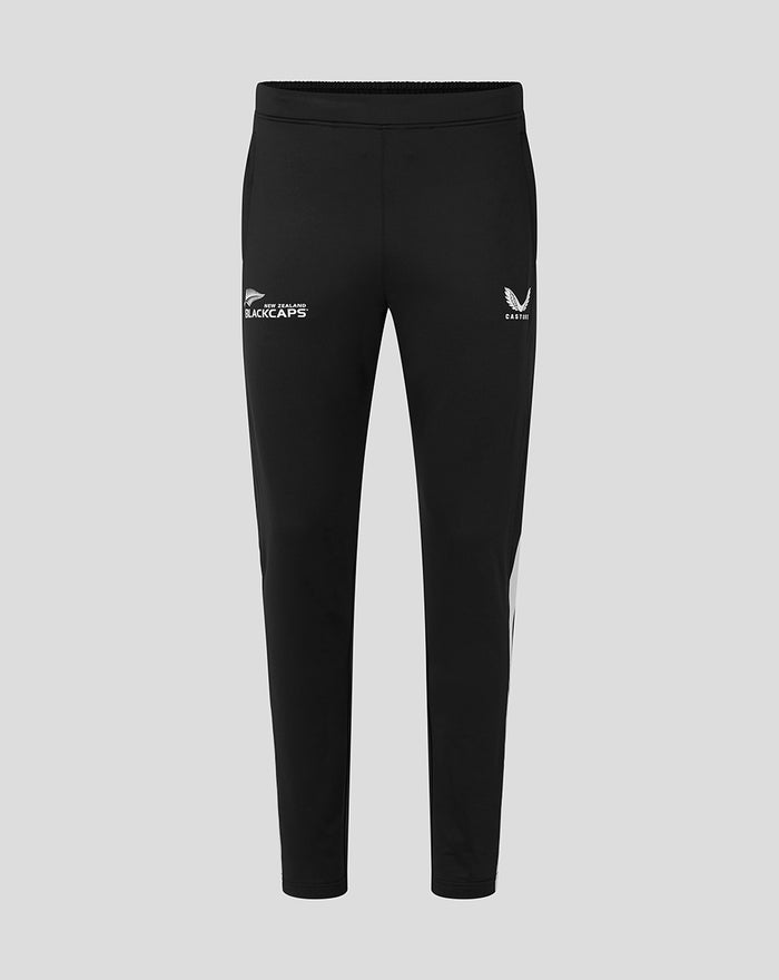 Front view of black training knit pants with white New Zealand BlackCaps logo on the left thigh and Castore wing emblem on the right thigh.