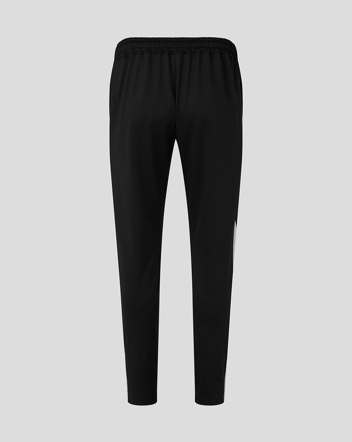Back view of black training knit pants with an elastic waistband