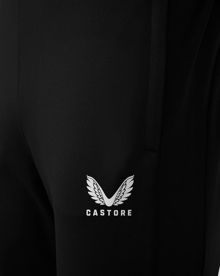 Close-up of black fabric on the thigh showing the Castore wing logo and CASTORE text.