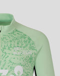 Close up of chest area with Blackcaps branding and bold white letters on patterned mint green fabric