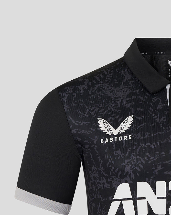 Front view of black ODI short sleeve shirt with dark abstract pattern and white Castore crest on chest