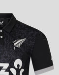 Shoulder and chest area of the black ODI shirt featuring a dark camo pattern and a white fern logo