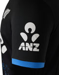 Black sleeve with white ANZ logo and blue cuff on the Womens T20 shirt.