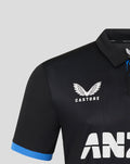 Front of black polo with CASTORE wing logo on chest and bold ANZ lettering across the front