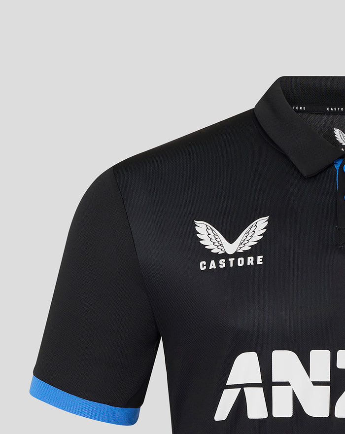Front of black polo with CASTORE wing logo on chest and bold ANZ lettering across the front