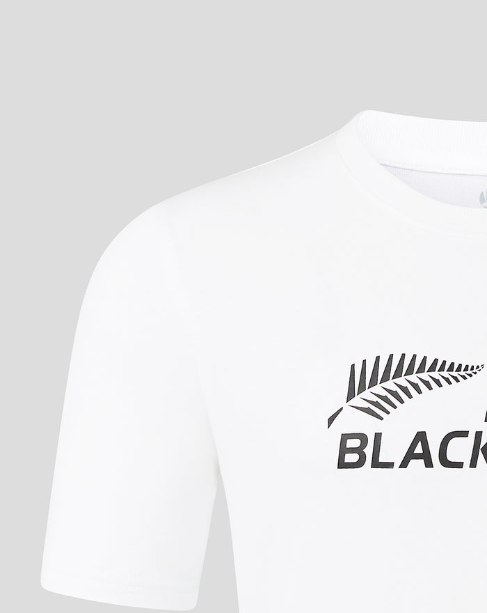 White tee shown front close-up with fern graphic and BLACK lettering on the chest.