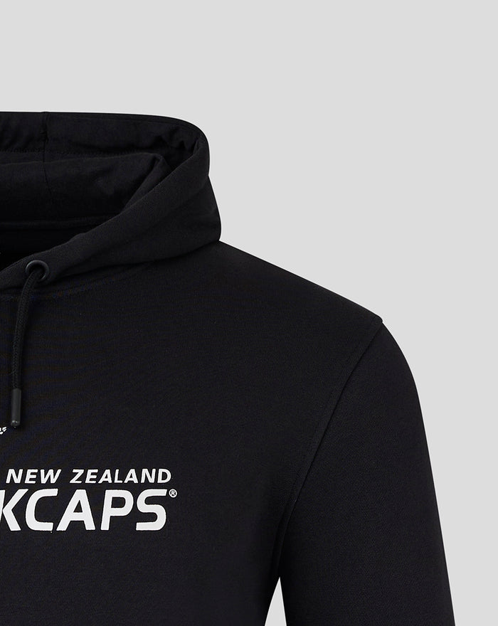 Close-up of the hood and shoulder on the black Core Black Caps Overhead Hoody showing the drawstring and fabric texture.