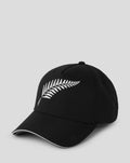Front view of black ODI playing cap with curved brim and white wing embroidery on the crown