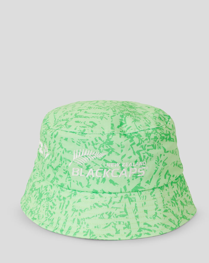 Profile view of lime green camo bucket hat with white New Zealand BlackCaps text on the front